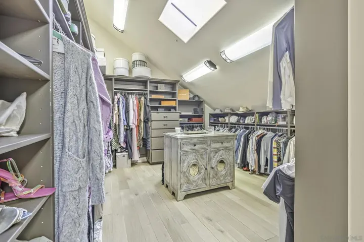 2 parts of the primary walk in closet , to house the largest of wardrobes.
