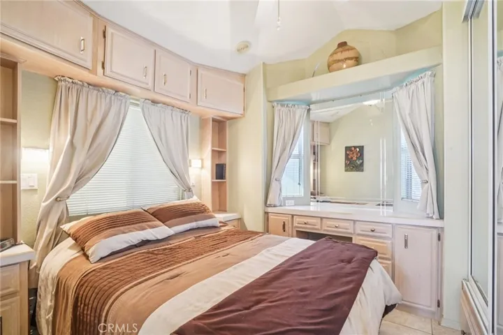 Bedroom has vanity area & lots of storage, including the lift up bed area.