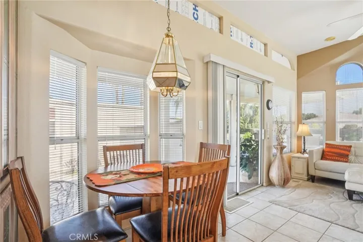 Dining nook with drop lighting.
