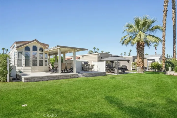 Nice size yard connects to common area.  Community supplies water for the lawn.
