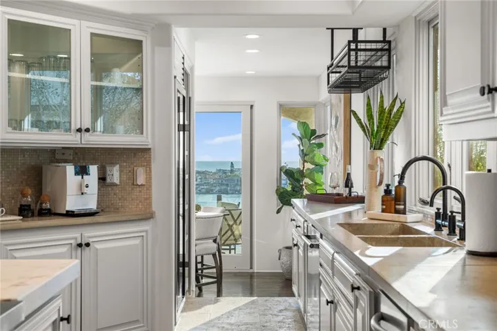 Kitchen-Sink/Dishwasher Adjacent/Subzero Full Size Wine Fridge on left with Bay View West