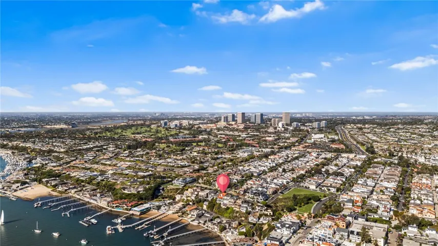Aerial w/Red Pin Drop on Estate-Newport Harbor, Yacht Clubs, Golf Country Club, Neighborhood Parks & Sports Courts, CDM Village 1/2 Mile to Restaurants/Shopping/Services, Fashion Island Mall World Class Shopping, Restaurants, Medical, and other Offices, MacArthur Blvd Access to Toll Roads & Freeways, and John Wayne Airport, View Northeast