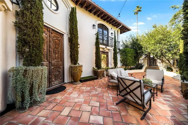 Courtyard Foyer-Main-2nd Level from Street/From Italy 1,000 Year Old 8' Ornate Carved Double Wooden Front Doors & Full Size Mirror of Italy/Mediterranean Landscape & Cypress Trees/Outdoor Seating/500 Year Old Ornamental Wood Gates Locked with Security Camera/DoorBell Ring Outside/Classic Spanish Tile-Seamless Indoor/Outdoor Experience w/Main Entrance Foyer/Quintessential Old World Essence Carried Throughout Estate