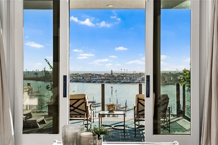 Primary Retreat-Lounge Seating View West Captures the Iconic Wedge Break and Harbor Entrance in a Single Cinematic Frame