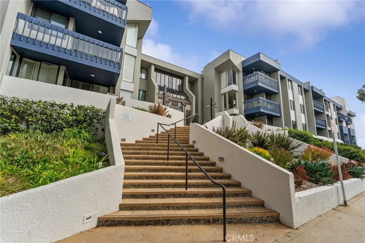 Stairways on both sides of the unit leading to the complex.