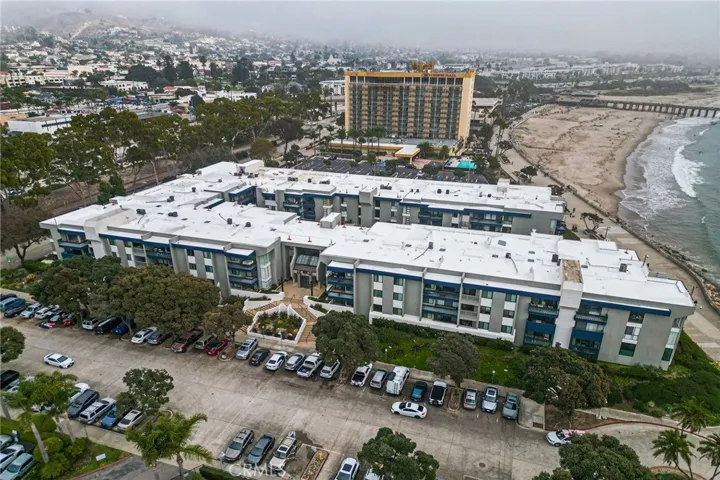 Hotel in the distance makes it convenient for guests to come and visit and walk on over. The complex in the front has two stairways up to the secured entry. Buzz guests in and they will walk to the left from the lobby and two doors down the right side to unit #113
