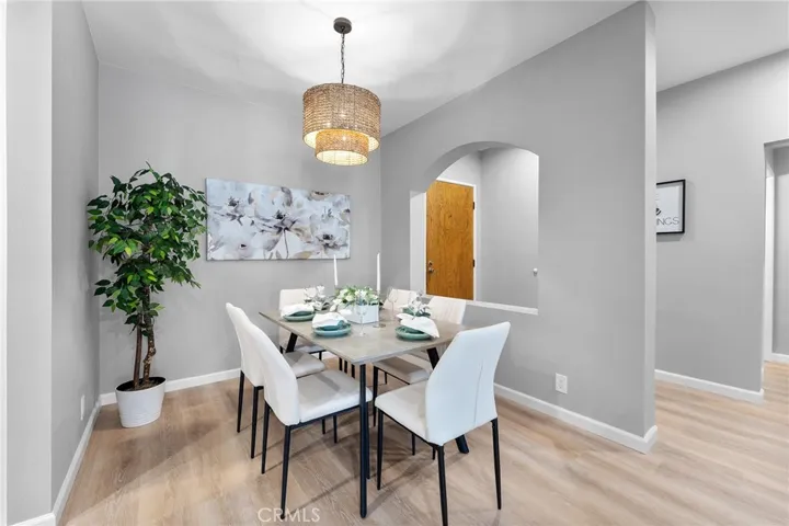 Lovely place to dine. New luxury vinyl plank flooring, new light fixture, newly painted. 9' ceilings. Formal entry with arch opening. Hallway to the right leads to bedrooms, bathrooms and laundry area.