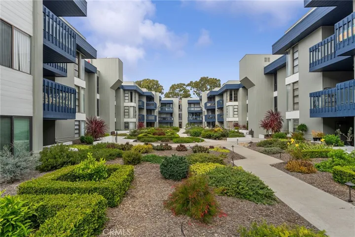 Looking away from the pool towards the courtyard. Unit #113 would be on the other side of the units left of image.