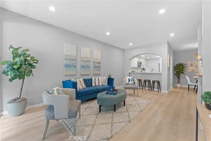 Beautifully updated, luxury vinyl plank flooring, recessed lighting,, newly painted. 9' ceilings. Room to dine casually at pass through to kitchen.