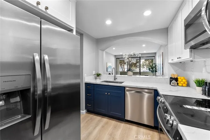 Gorgeous kitchen with soft closed cabinet features. Quartz counter has beautiful veining that is classic in design. New appliances. New sink and fixtures. All new for you.