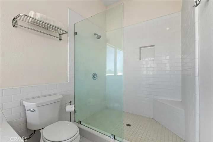 The primary ensuite also includes a spacious walk-in shower.