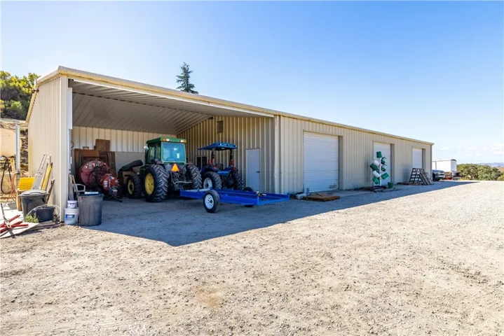 3,000 sq. ft. shop with three roll-up doors, overhang, and central heating & A/C. This is a ranchers dream.