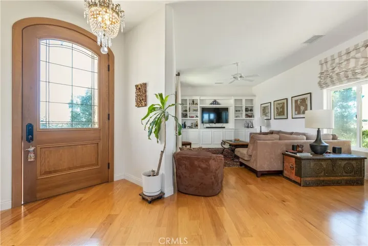 Cozy family room featuring built-in shelving and entertainment center.