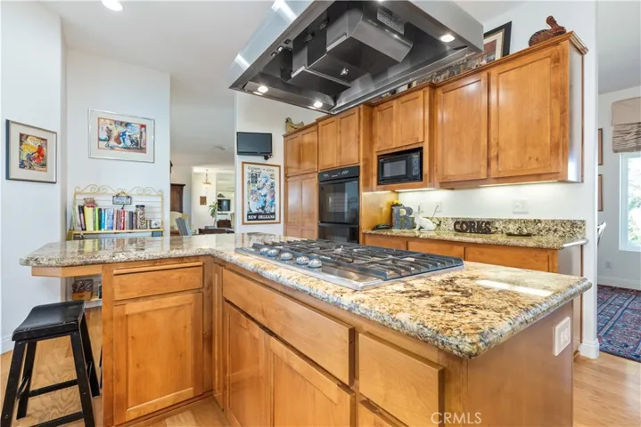 Versatile L-shaped island great for cooking, dining, and hosting guests.