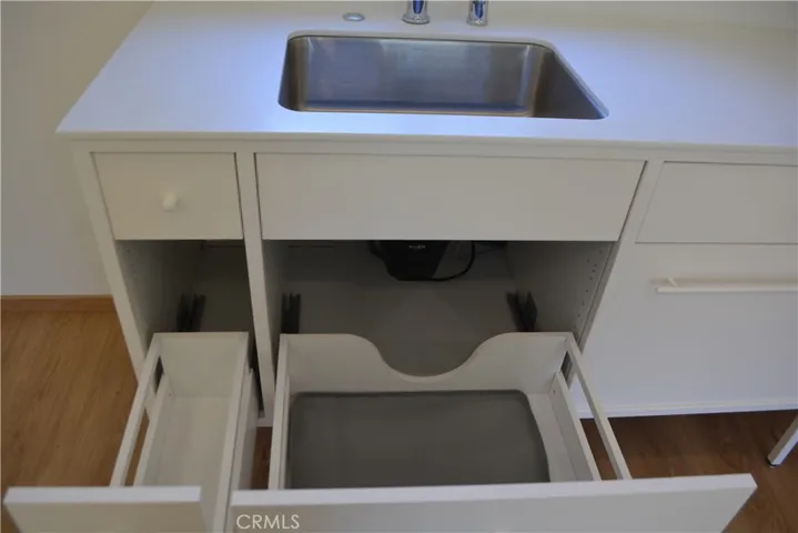 Soft close, slide out cabinets near sink.