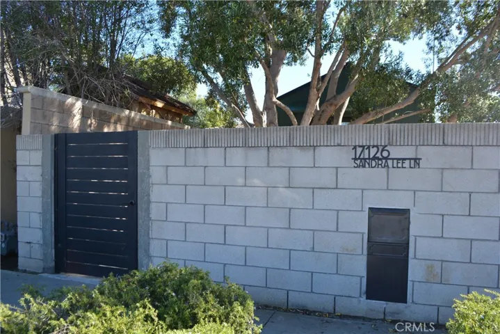 Private entrrance with lockable gate, address placard and secure mailbox.