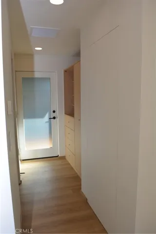 Built-in closet and cabinetry in hall.