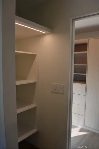 Built in linen and sundry closet across from washer/dryer.