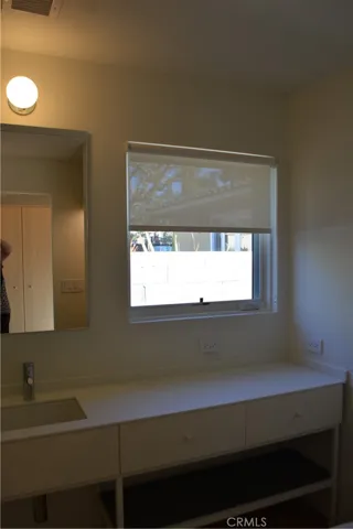 Sink, vanity and extra counter space.
