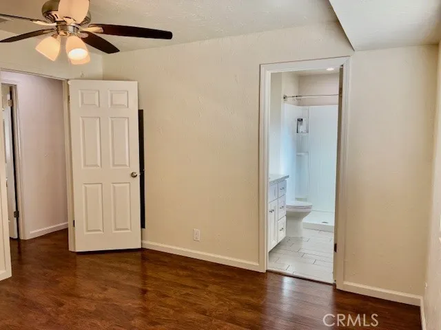 Primary bedroom looking into bathroom