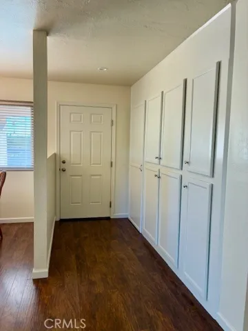 Front door entrance with all the cabinets and storage