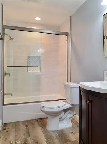 Guest bath with custom vanity and tilework.