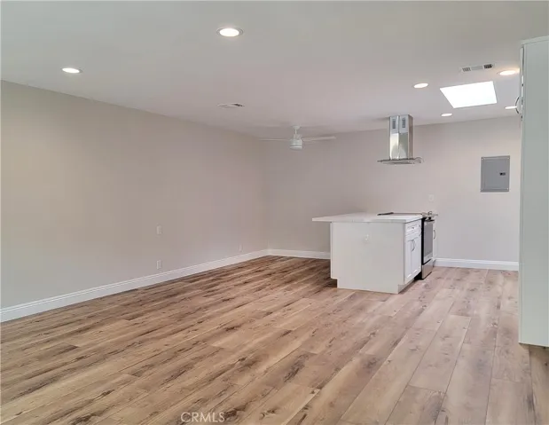 Woodlike laminate floors and open floor plan.