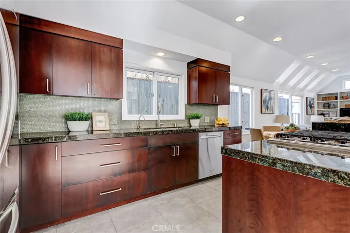 Kitchen with soft close drawers, granite counters and stainless appliances.