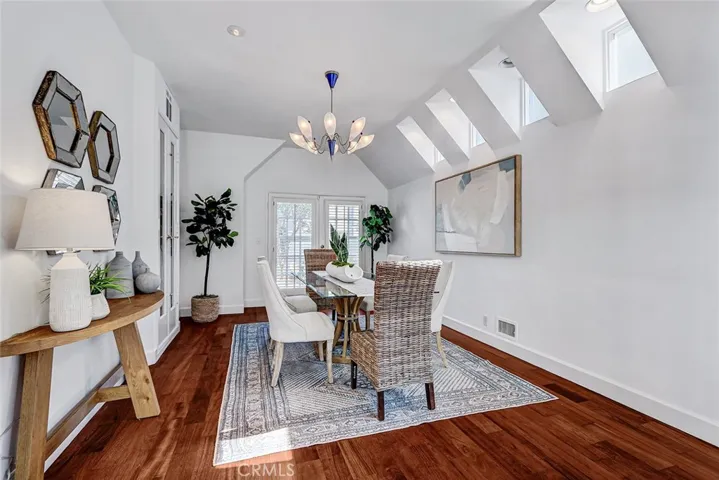 Dining room with skylights and wine storage.