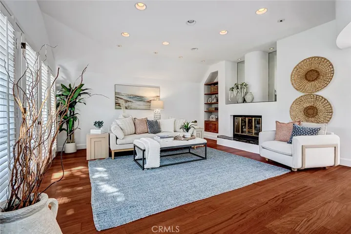 Very spacious living room with high ceilings and fireplace.