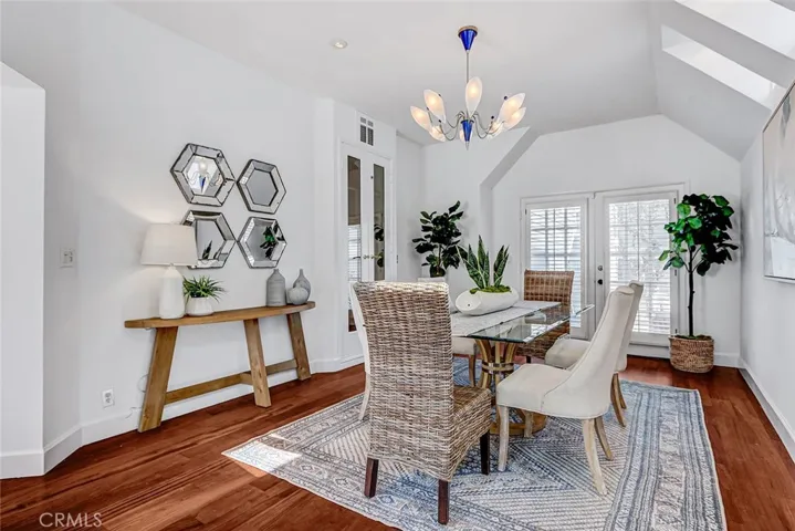 Beautiful dining room with access to outdoor areas.