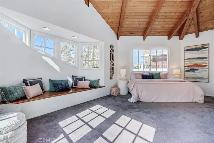 2nd bedroom with storage bench sitting area.