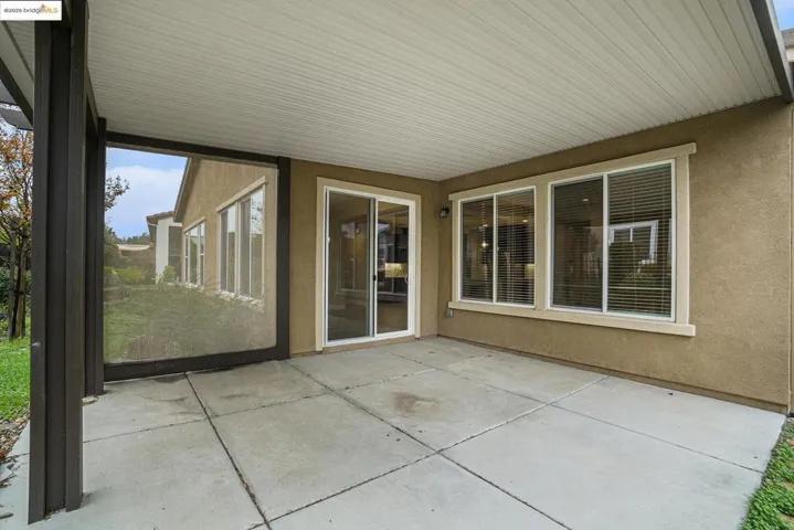 Unfurnished sunroom featuring a patio