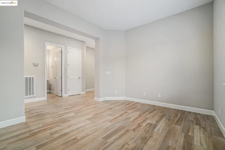 Spare room featuring light wood finished floors