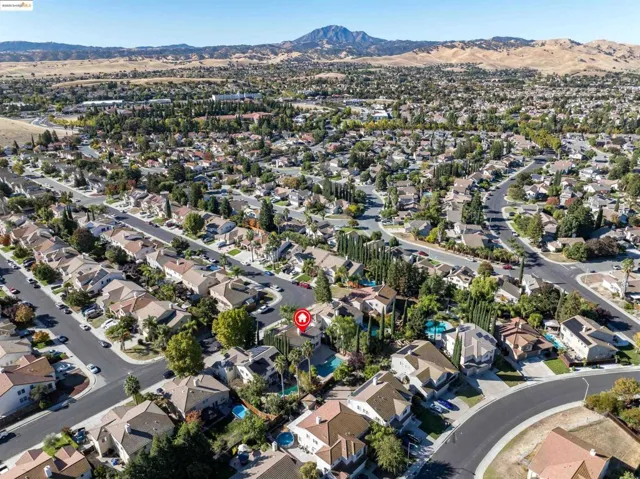 Aerial view of property's location featuring nearby suburban area