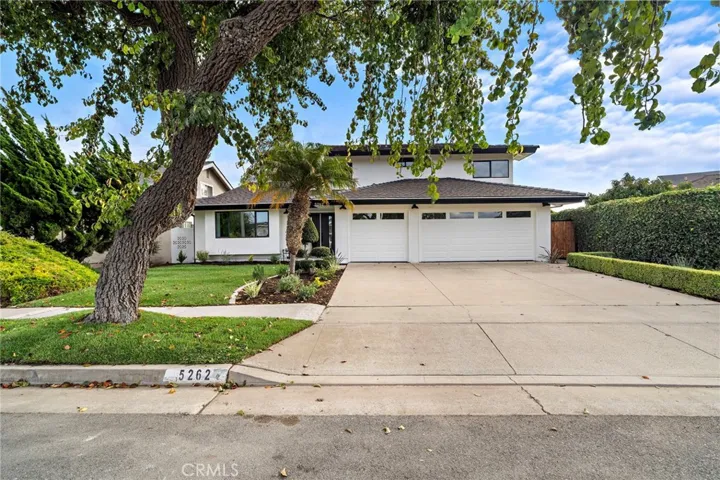 Large driveway and attached with 3-car garage