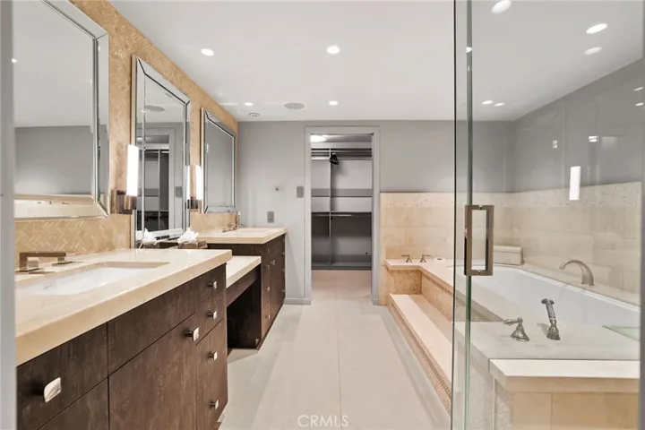 Primary with soaking/jetted tub and shower, private water closet