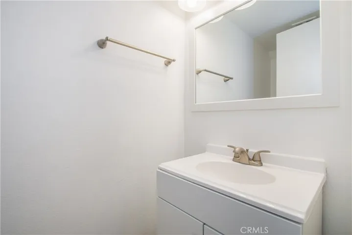 Guest Bathroom - Looks better in person! Newer Mirror, Lights & Hardware, etc...