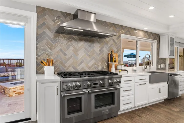 Massive 10' quartz island complete with generous storage and a dedicated wine and beverage fridge