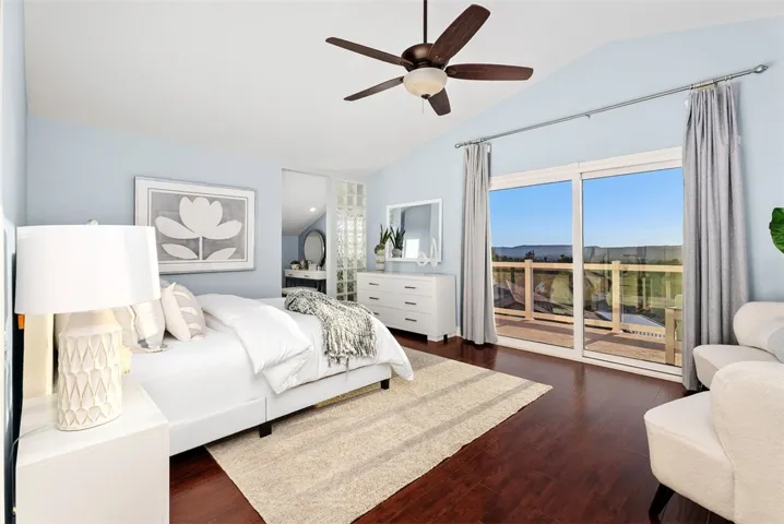 Primary suite features two walk-in closets, an ensuite bathroom, and a private balcony