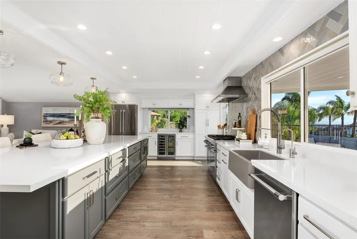 Massive 10' quartz island complete with generous storage and a dedicated wine and beverage fridge