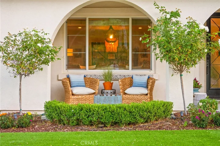 Front porch; left of front door