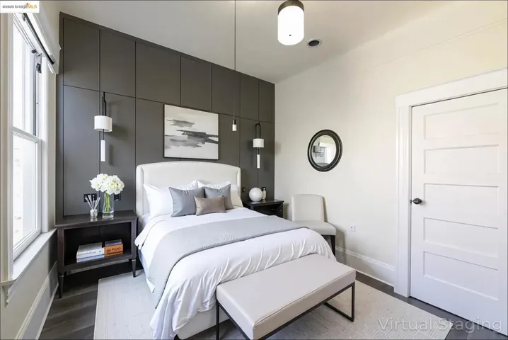 Virtually staged Bedroom 2 with baseboards and wood finished floors