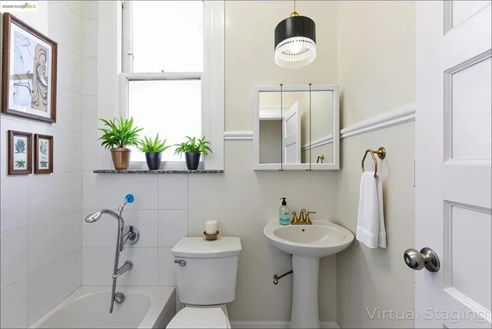 Virtually staged Full bathroom with toilet