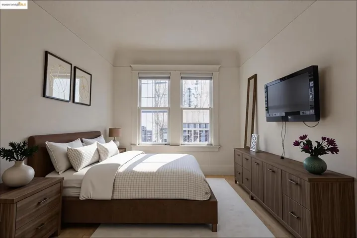 Bedroom featuring baseboards and light wood-type flooring