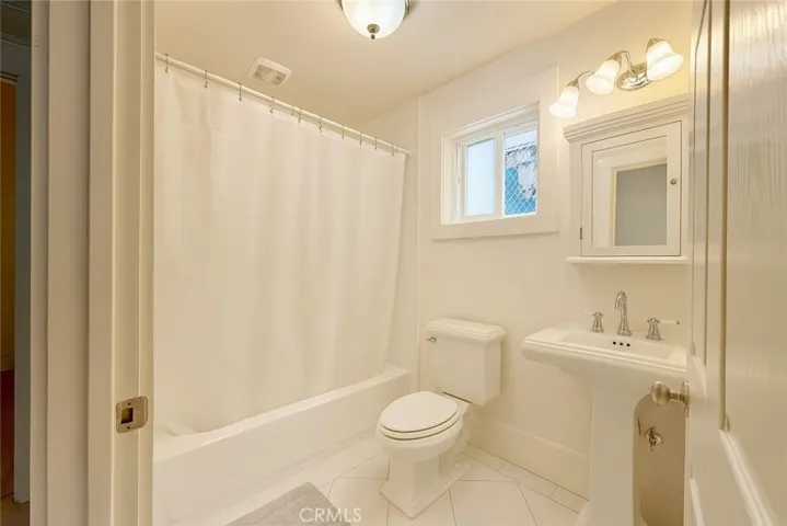 Primary Bathroom 
Virtually edited – furniture digitally removed + lighting enhanced