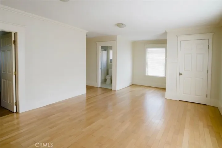 Primary Bedroom Virtually edited – furniture digitally removed + lighting enhanced