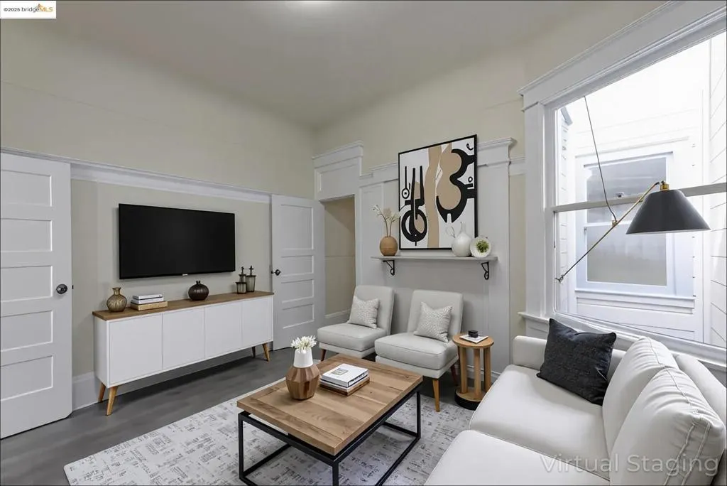 Virtually Staged Living room featuring dark wood finished floors