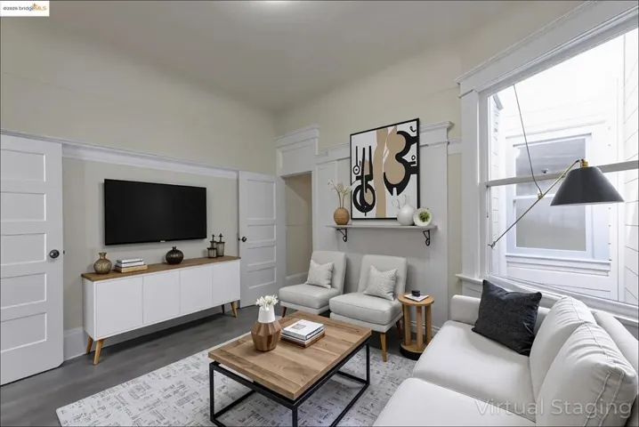 Virtually Staged Living room featuring dark wood finished floors