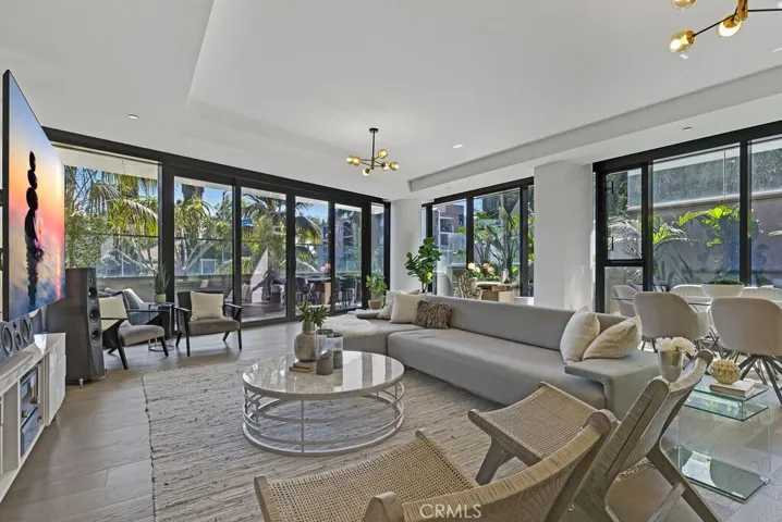 Very large, light filled great room (38' x 24') overlooking the patio and lush greenery